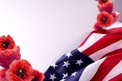 Pearl Harbor National Remembrance day banner template with united states flag, red poppies, and copy space for text.
