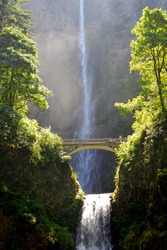 Multnomah waterfalls with bridge and water in background