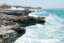 Big waves hitting eroded rocky coastline on Grand Bahama island.