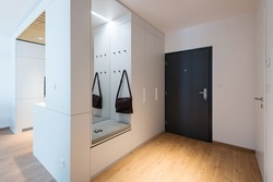 Hallway with closet in modern apartment