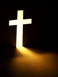 Cross with light shafts. Faith symbol.