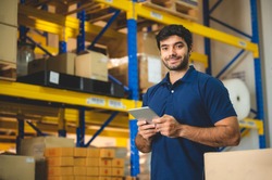 Male warehouse worker portrait in warehouse storage