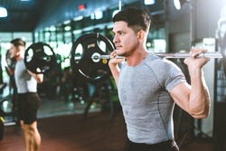 strong athlete man person exercising in the sport gym, workout exercise training in fitness for body strong and fit, bodybuilding training and healthy people lifestyle concept