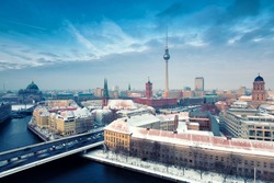 Berlin Skyline Winter City Panorama with snow and blue sky - famous landmark in Berlin, Germany, Europe