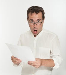 Shocked man reading a document