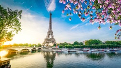 Paris Eiffel Tower and river Seine with sunrise in Paris, France. Eiffel Tower is one of the most iconic landmarks of Paris, web banner format ar early spring morning