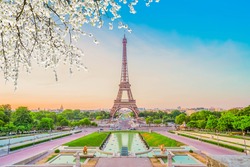 Paris Eiffel Tower and Trocadero garden at spring sunset in Paris, France. Eiffel Tower is one of the most famous landmarks of Paris., toned