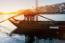   Douro river and traditional port wine boats at sunset, Portugal