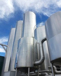 Large aluminum storage tanks of a modern factory