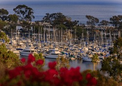 Sunset over luxury yachts and boats in Dana Point harbor, Orange county in Southern California