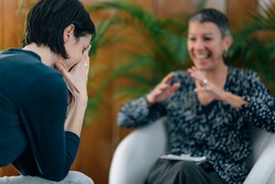 NLP or Neuro-linguistic Programming Practitioner having a Conversation with a client