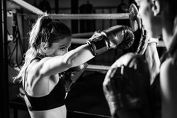 Women on boxing training . Black and white