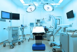 equipment and medical devices in modern operating room take with art lighting and blue filter 