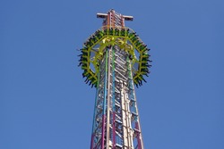 Amusement ride; isolated against blue summer sky