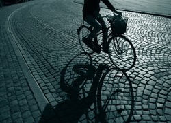 Lonely female cyclist on her way home from work - Denmark.