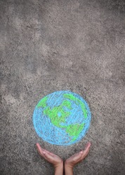 Closeup hands holding earth draw with chalk. World harmony green peace environment earth day together, sustain ecology, climate change, save the world, ecosystem social network concept banner.