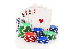 Four aces and stacks of poker chips isolated on white.