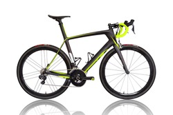 Professional carbon race road bike isolated on white background. Fluor color details.