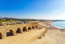 The aqueduct built during the reign of Herod the Great. January sunny and clear day. Aerial view photos. Israel. Mediterranean sea beach. Caesarea.