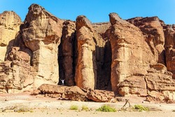 Solomon pillars of Timna park. They were formed naturally by erosion of hard red sandstone. Magnificent sandstone multi-colored rocks. The resort of Eilat. Israel. Hot November day. 
