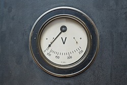 Old rusty voltage meter unit, industrial volt measurement