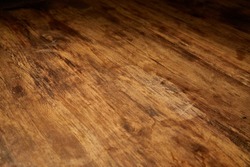 Aged wood desk in dim light