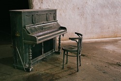 Old piano in a run down hall
