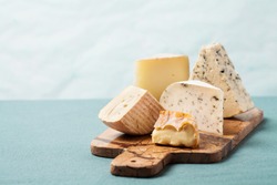 Cheese board: variety of cheeses on marble serving board