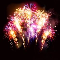 Colourful golden and pink fireworks display for celebrations.