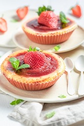 Yummy strawbery cheesecake with fresh fruits. Sweet summer cheesecake. Sweet and fruity strawberry cheesecake.