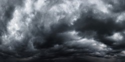 Dramatic dark stormy sky with rain clouds as background