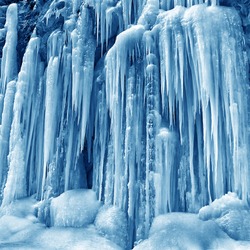 frozen small mountain waterfall close up