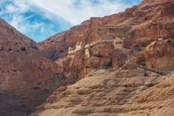 The Monastery of the Temptation on the red rocks. The Mount of Temptation in Jericho, Palestine. Greek Orthodox monastery. Judean desert