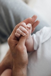 baby's hand with father's hand. little infant's hand. baby with dad