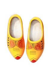 traditional Dutch wooden yellow shoes isolated
