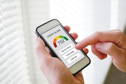 credit score concept on the screen of smart phone, checking payment history and ranking in bank online