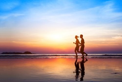 workout background, two people jogging on the beach at sunset, runners silhouettes, healthy lifestyle concept 