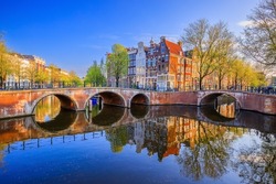 Amsterdam, Netherlands. The Keizersgracht (Emperor's) canal and bridges in the morning.