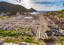 Ruins of Knidos ancient city on Datca peninsula in Turkey with old stones in rows and bright back light