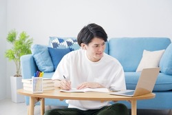 Asian man studying in an online course. at home