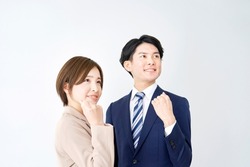 smiling Asian businesswoman and businessman guts pose gesture