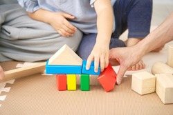 Asian little girl playing with the building blocks, no face