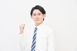 smiling Asian businessman guts pose gesture in white background