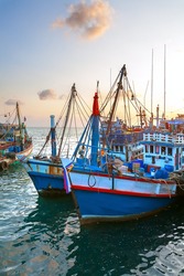 Red fishing boat in the port in the evening (Thailand).