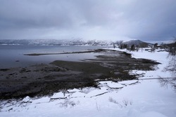 Snowy landscape nature with misty sky, Tromso, Norway