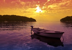 Beautiful Sunset scene with a small boat