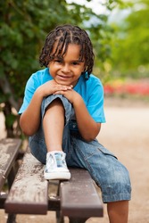 Outdoor portrait of a cute african american little boy