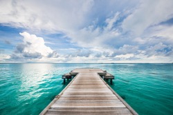 Jetty leads to the sea. Find your way and purpose in life. Wooden road and way to the future and new discoveries. Freedom, success, start concept. Rest, travel and enjoy life, relax view and calmness
