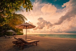 Beautiful beach. Chairs on the sandy beach near the sea. Summer holiday and vacation concept for tourism. Inspirational tropical landscape. Tranquil scenery, relaxing beach, tropical landscape design