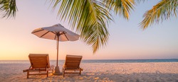 Beautiful beach. Chairs on the sandy beach near the sea. Summer holiday and vacation concept for tourism. Inspirational tropical landscape. Tranquil scenery, relaxing beach, tropical landscape design